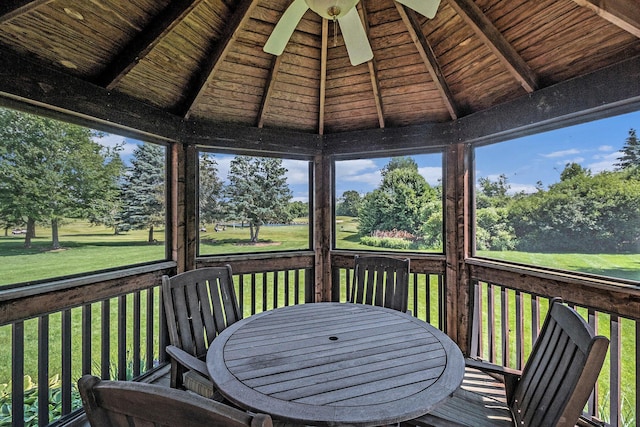 712 Dornoch Dr, Ann Arbor, MI 48103 - sunroom / solarium featuring a ceiling fan and view of scattered trees