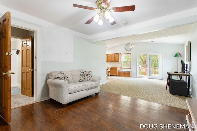 3747 Leonard St NW, Grand Rapids, MI 49534 - living area featuring ceiling fan, wood finished floors, and vaulted ceiling