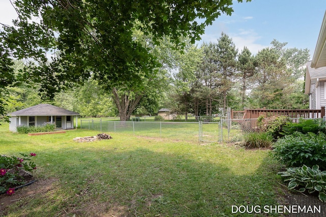 3747 Leonard St NW, Grand Rapids, MI 49534 - fenced backyard featuring a gate and an outbuilding