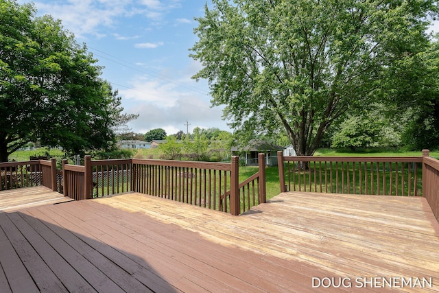 3747 Leonard St NW, Grand Rapids, MI 49534 - deck with a lawn and a storage shed