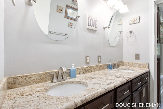 3747 Leonard St NW, Grand Rapids, MI 49534 - full bathroom featuring double vanity