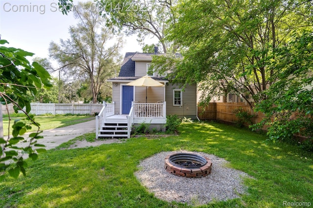 1217 E Madge Ave, Hazel Park, MI 48030 - back of property with a wooden deck and a fire pit
