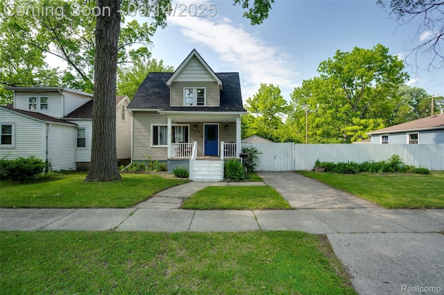 1217 E Madge Ave, Hazel Park, MI 48030 - bungalow-style house with a porch, driveway, and roof with shingles