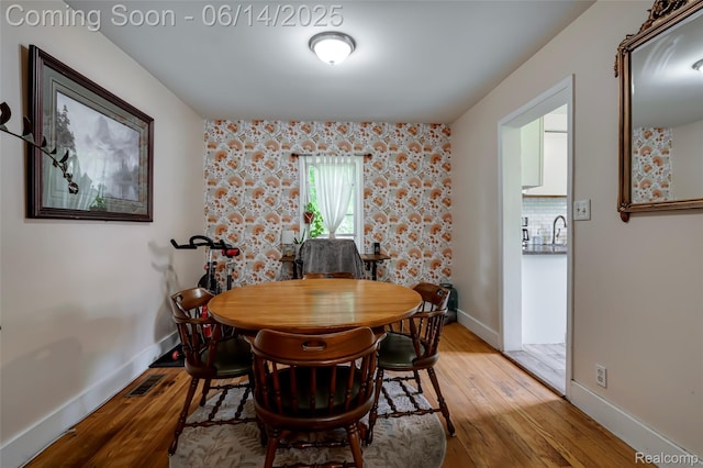 1217 E Madge Ave, Hazel Park, MI 48030 - dining space with light wood-style flooring and baseboards