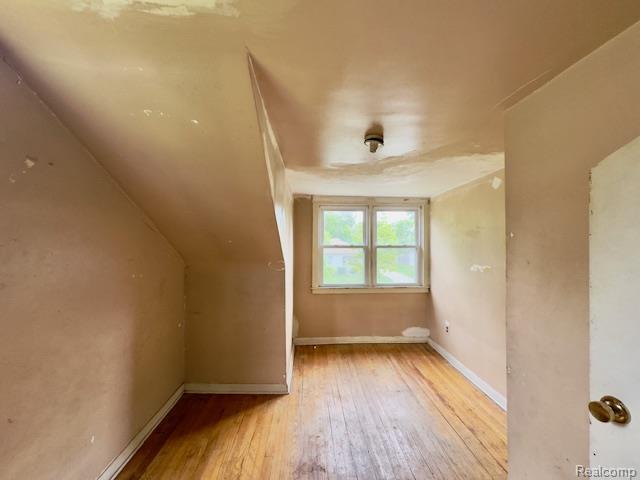 14171 Plainview Ave, Detroit, MI 48223 - additional living space featuring hardwood / wood-style floors and baseboards