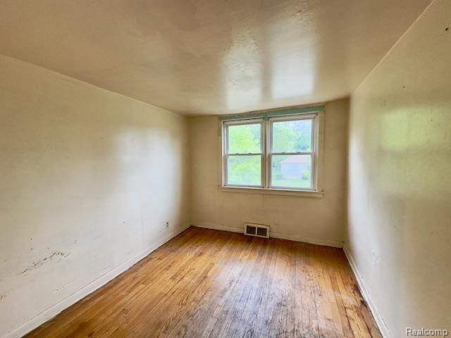 14171 Plainview Ave, Detroit, MI 48223 - unfurnished room with wood finished floors and baseboards