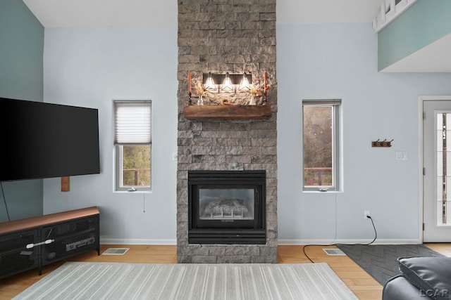 13832 Grandview Dr, Cement City, MI 49233 - living room with a large fireplace and wood finished floors