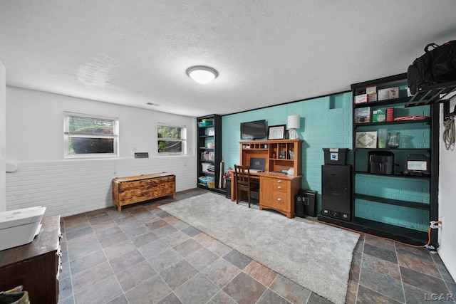 13832 Grandview Dr, Cement City, MI 49233 - office area with stone finish floors and a textured ceiling