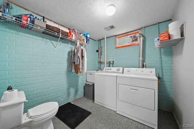 13832 Grandview Dr, Cement City, MI 49233 - washroom with washer and dryer and a textured ceiling