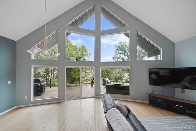 13832 Grandview Dr, Cement City, MI 49233 - living room with high vaulted ceiling and wood finished floors