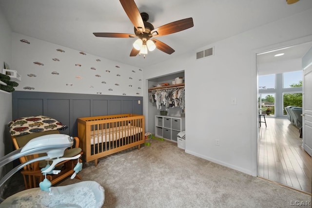 13832 Grandview Dr, Cement City, MI 49233 - bedroom featuring a decorative wall, a closet, ceiling fan, and carpet