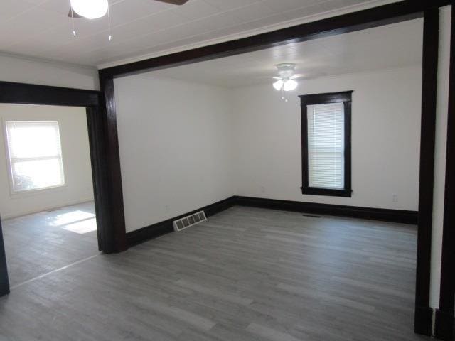 516 Cedar St, Owosso, MI 48867 - unfurnished room featuring ceiling fan and wood finished floors
