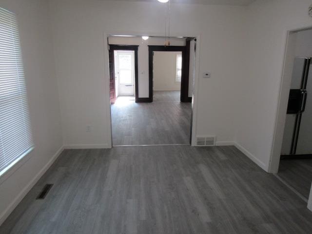 516 Cedar St, Owosso, MI 48867 - empty room featuring wood finished floors and baseboards