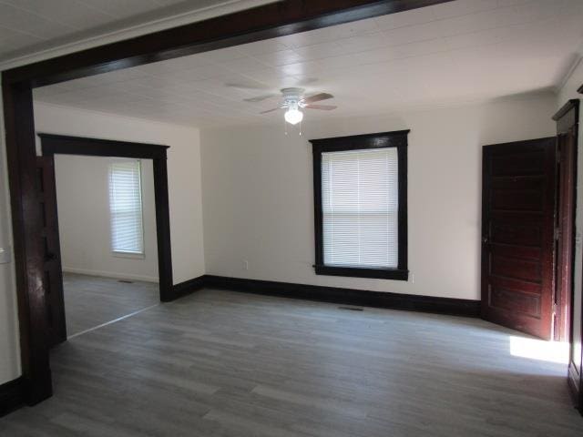 516 Cedar St, Owosso, MI 48867 - empty room featuring wood finished floors and a ceiling fan