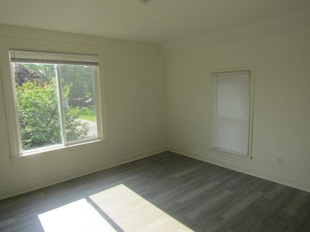 516 Cedar St, Owosso, MI 48867 - spare room with plenty of natural light and wood finished floors