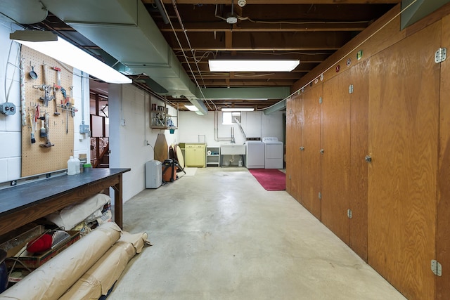 2104 Winchell Dr, Ann Arbor, MI 48104 - below grade area featuring washer and clothes dryer and a workshop area