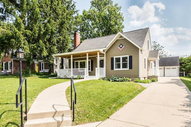 2104 Winchell Dr, Ann Arbor, MI 48104 - view of front of property featuring a porch, a chimney, a front yard, an outdoor structure, and roof with shingles