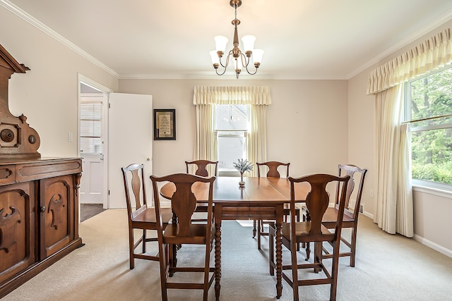 2104 Winchell Dr, Ann Arbor, MI 48104 - dining area with a chandelier, light colored carpet, and crown molding