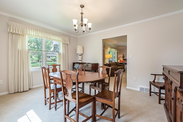 2104 Winchell Dr, Ann Arbor, MI 48104 - dining area featuring a chandelier, light colored carpet, and ornamental molding