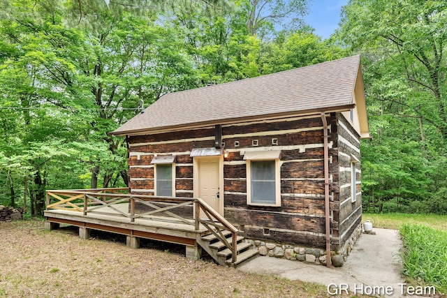 8607 S Ferris Ave, Newaygo, MI 49337 - view of front of home with roof with shingles and a deck