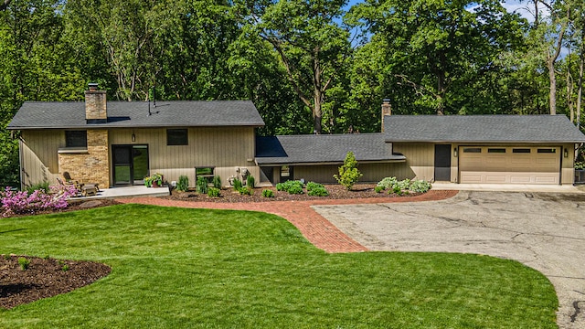 1117 Honey Creek Ave NE, Ada, MI 49301 - view of front of property featuring a chimney, driveway, a garage, a front lawn, and a shingled roof