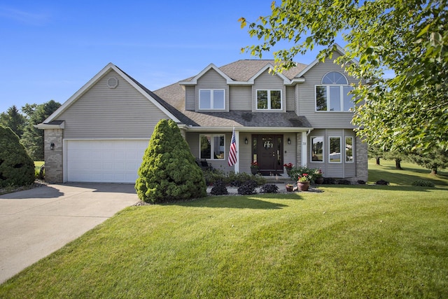 78 Capercaillie Ln, Battle Creek, MI 49014 - traditional home with concrete driveway, an attached garage, a front yard, and a shingled roof