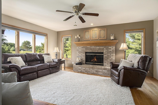 78 Capercaillie Ln, Battle Creek, MI 49014 - living area featuring ceiling fan, wood finished floors, a brick fireplace, and recessed lighting