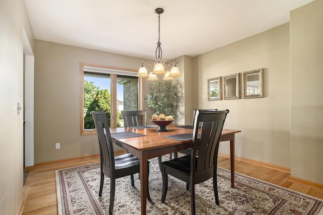 78 Capercaillie Ln, Battle Creek, MI 49014 - dining room with a chandelier and light wood finished floors