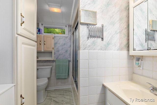 10667 220th Ave, Big Rapids, MI 49307 - full bath with vanity, marble look tiles, tile walls, and a stall shower