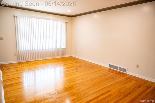 30320 Moulin Ave, Warren, MI 48088 - spare room featuring wood finished floors and crown molding