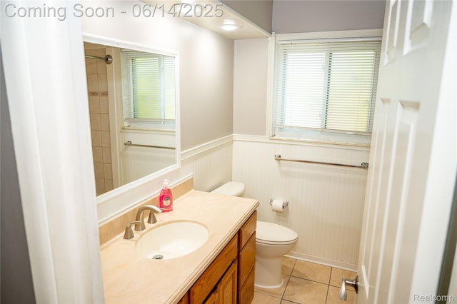 30320 Moulin Ave, Warren, MI 48088 - full bathroom featuring wainscoting, vanity, tile patterned flooring, and a shower