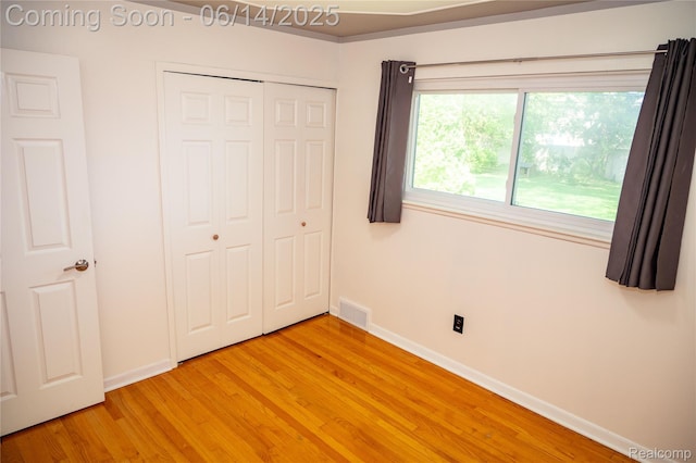 30320 Moulin Ave, Warren, MI 48088 - unfurnished bedroom with light wood-type flooring and a closet