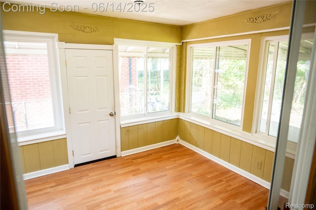 30320 Moulin Ave, Warren, MI 48088 - unfurnished sunroom with wood finished floors and baseboards
