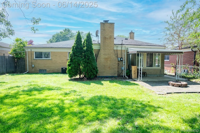 30320 Moulin Ave, Warren, MI 48088 - back of property with brick siding, an outdoor fire pit, a patio, and a chimney