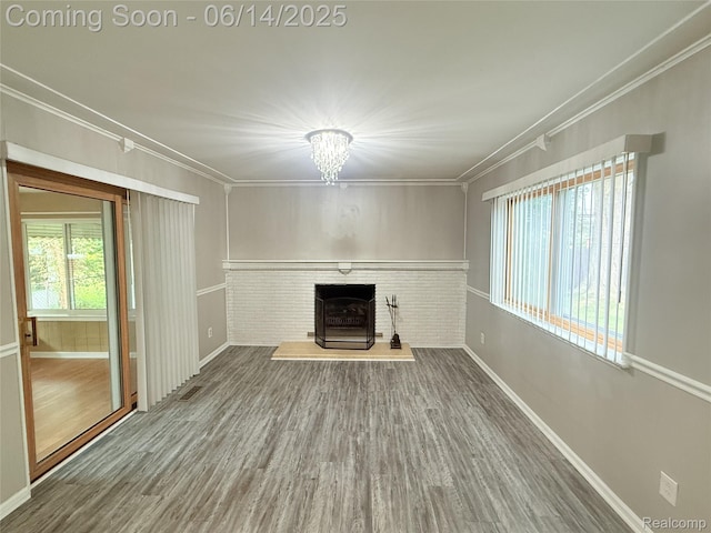30320 Moulin Ave, Warren, MI 48088 - unfurnished living room featuring ornamental molding, wood finished floors, and a chandelier