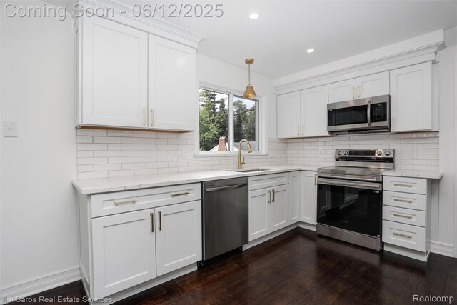 249 Ridgemont Rd, Grosse Pointe, MI 48236 - kitchen featuring stainless steel appliances, dark wood-style flooring, white cabinets, decorative backsplash, and recessed lighting