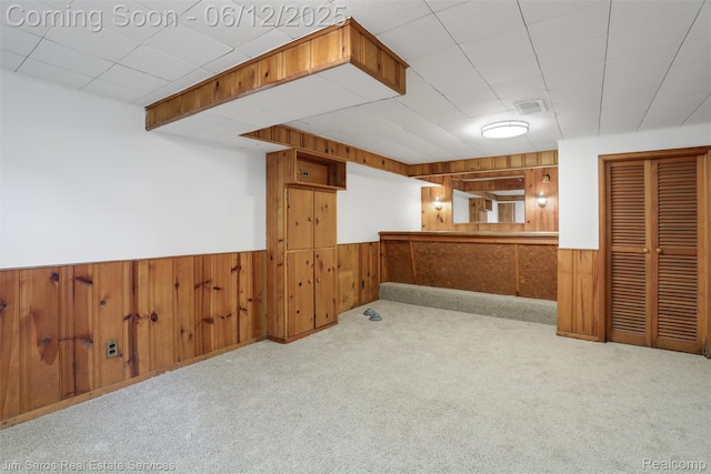 249 Ridgemont Rd, Grosse Pointe, MI 48236 - finished below grade area featuring wood walls, a wainscoted wall, and carpet floors