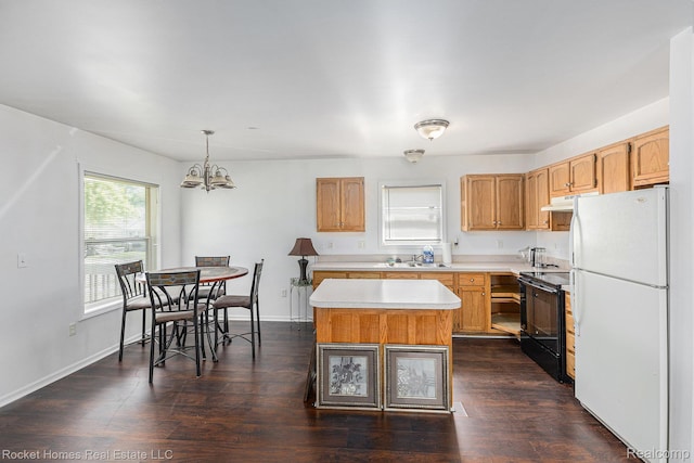 354 Ferry Ave, Pontiac, MI 48341 - kitchen with freestanding refrigerator, black / electric stove, light countertops, a chandelier, and a kitchen island
