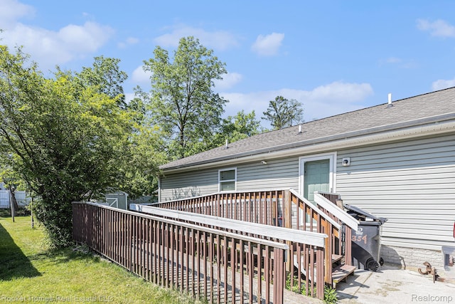 354 Ferry Ave, Pontiac, MI 48341 - back of house featuring a shed, a deck, roof with shingles, and a yard