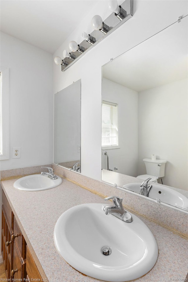 354 Ferry Ave, Pontiac, MI 48341 - bathroom with double vanity and toilet
