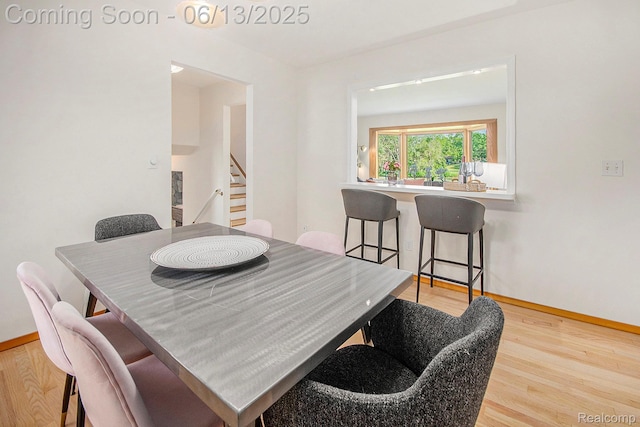 3255 School House Dr, Waterford, MI 48329 - dining area featuring wood finished floors and stairway
