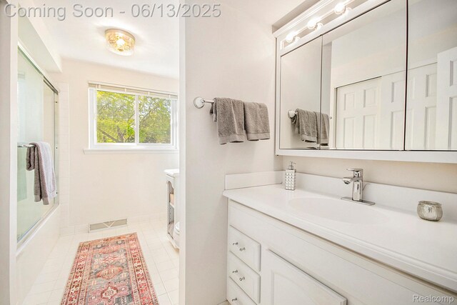3255 School House Dr, Waterford, MI 48329 - bathroom featuring vanity, enclosed tub / shower combo, and tile patterned floors