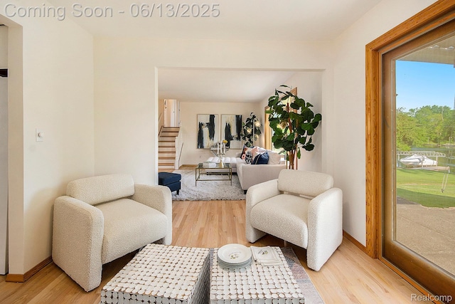 3255 School House Dr, Waterford, MI 48329 - living area with light wood-type flooring and stairway
