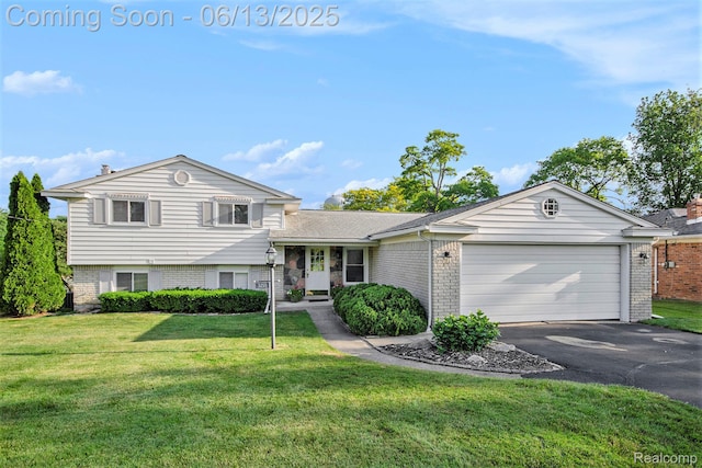 3255 School House Dr, Waterford, MI 48329 - tri-level home featuring brick siding, a garage, asphalt driveway, and a front lawn