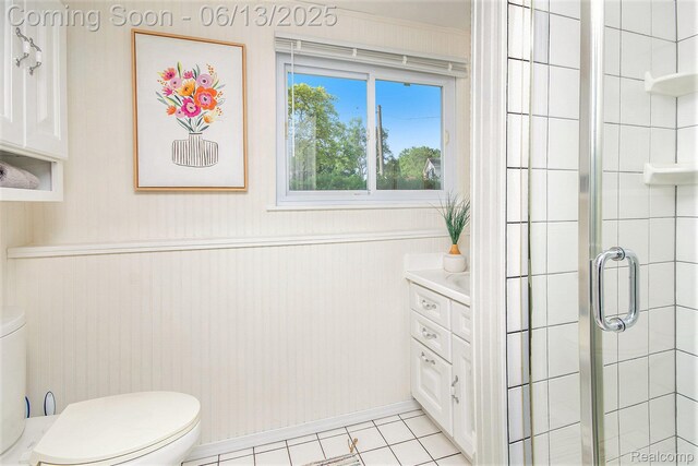 3255 School House Dr, Waterford, MI 48329 - bathroom with a stall shower, tile patterned flooring, a wainscoted wall, and vanity