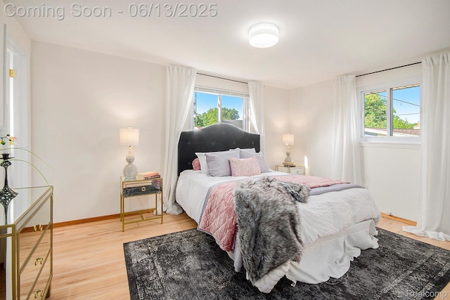 3255 School House Dr, Waterford, MI 48329 - bedroom featuring light wood-style flooring and baseboards