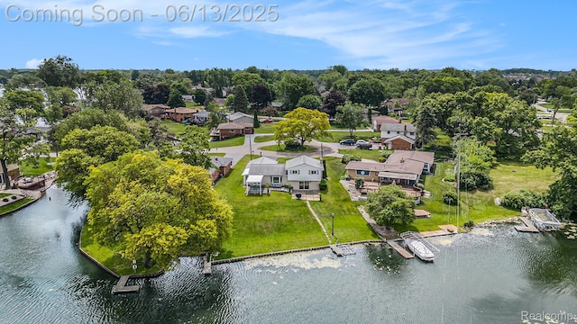 3255 School House Dr, Waterford, MI 48329 - aerial view of residential area featuring a large body of water and a tree filled landscape