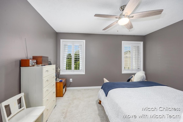 2321 S Highland View Cir SE, Grand Rapids, MI 49506 - bedroom featuring light carpet, multiple windows, and a ceiling fan