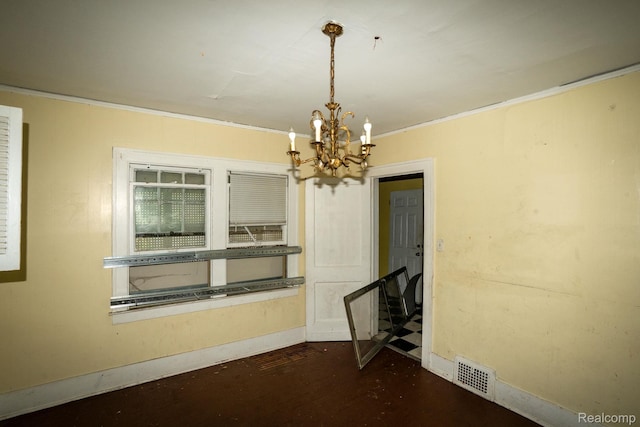 2476 Ford St, Detroit, MI 48238 - unfurnished room featuring a chandelier, ornamental molding, and dark wood-type flooring