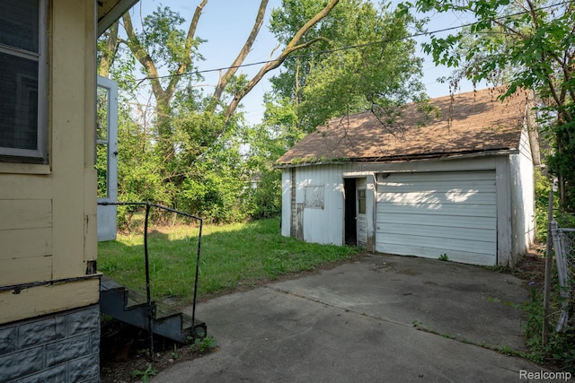 2476 Ford St, Detroit, MI 48238 - detached garage featuring concrete driveway